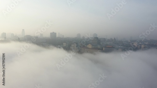 Aerial view of the city in the fog.