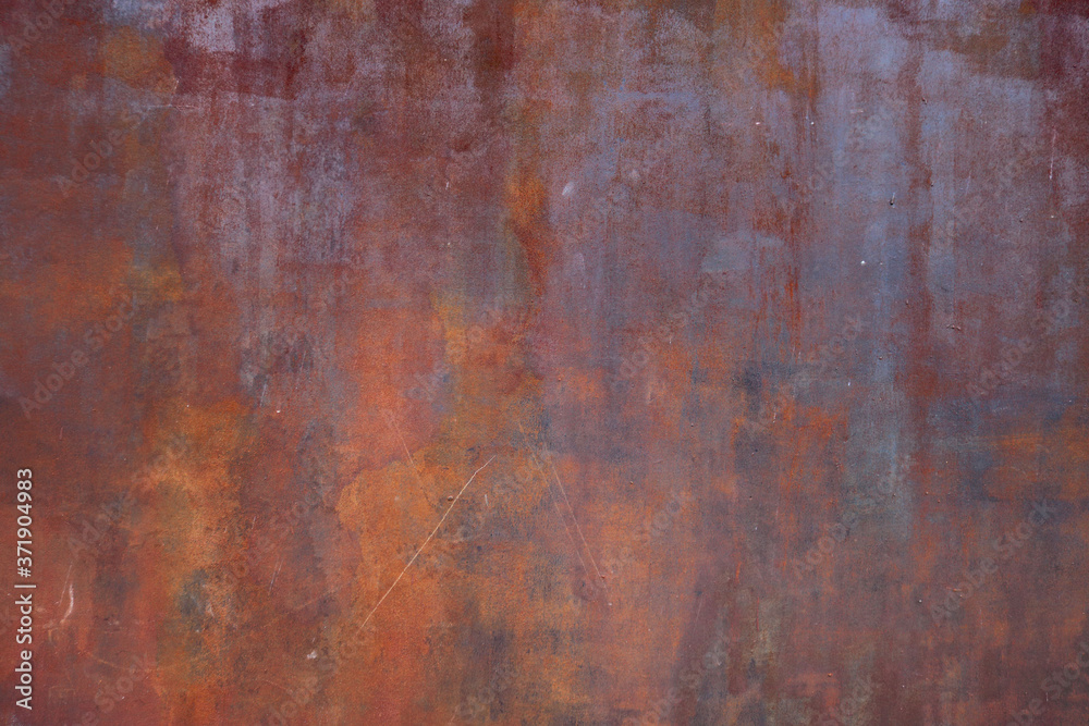 rusty metal surface with red and orange tones - worn irregular steampunk background with scratches for a wallpaper rusty metal surface with red and orange tones - worn irregular steampunk background with scratches for a wallpaper
