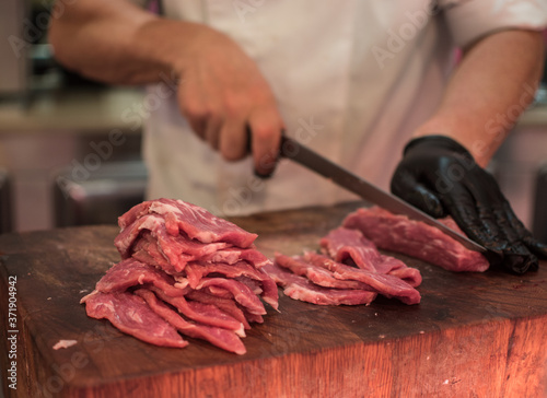 cutting meat on a chopping board