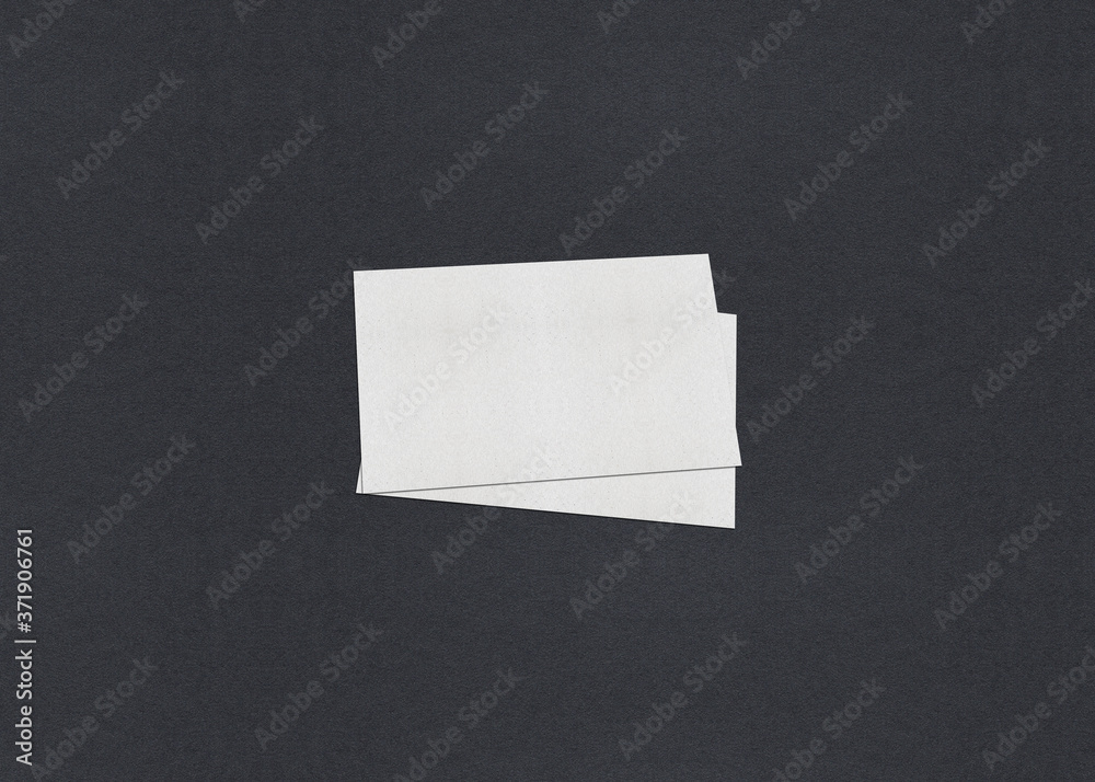 Blank white Business card mockup stacks on grey textured paper background. Blank white Business card mockup stacks on grey textured paper background.