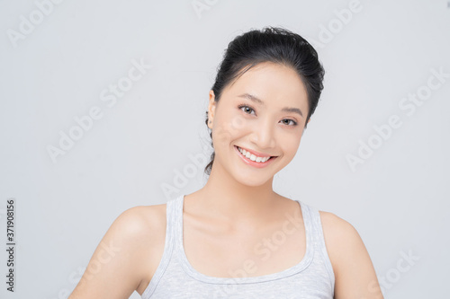 Beautiful female asian face with natural perfect skin in studio portrait