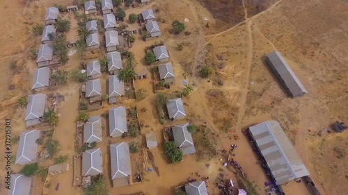 Aerial tilt of community village in Keffi Nasarawa, Nigeria during Harmattan photo