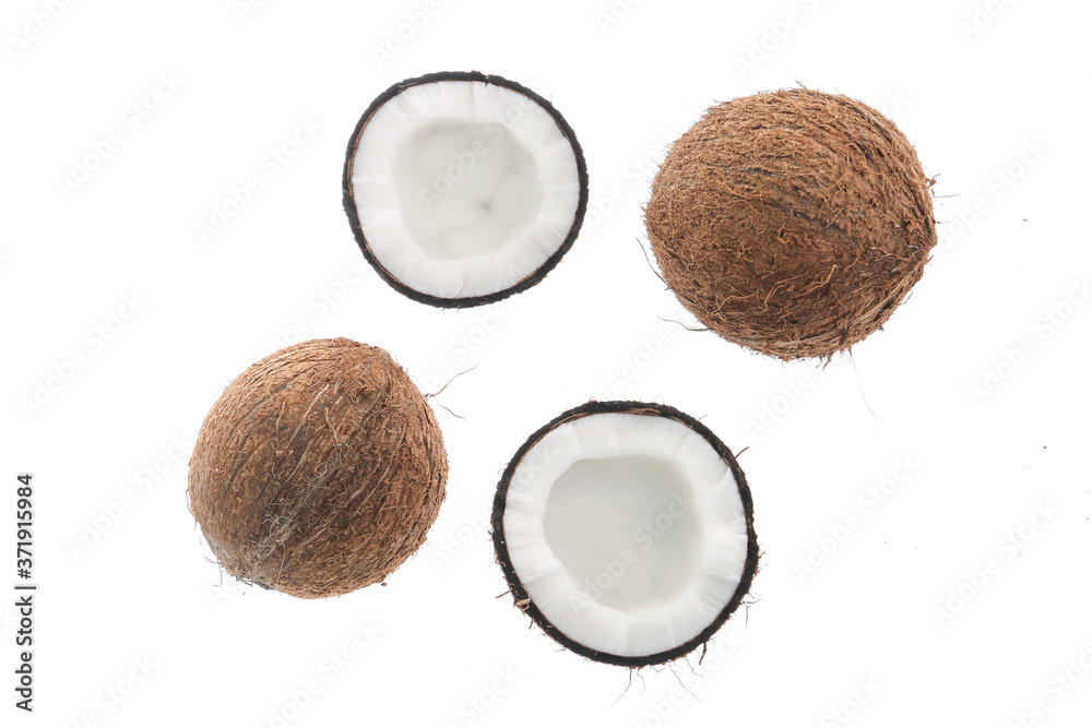Fresh raw coconut with palm leaves isolated on white background. High resolution image