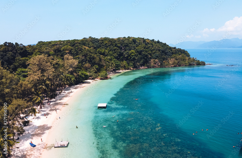 Clear water on the island,Bright blue sea and wooden boat The tourism Clear water on the island,Bright blue sea and wooden boat The tourism