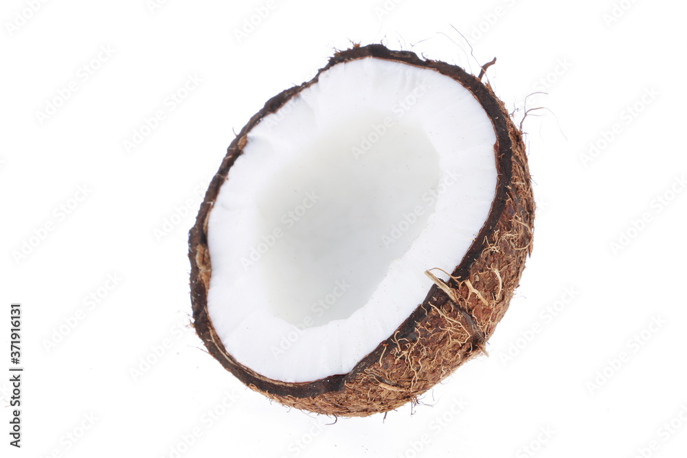 Fresh raw coconut with palm leaves isolated on white background. High resolution image Fresh raw coconut with palm leaves isolated on white background. High resolution image