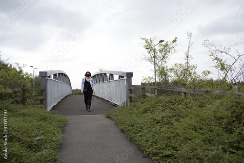 COVID Girl on a bridge in Leicestershire. photo