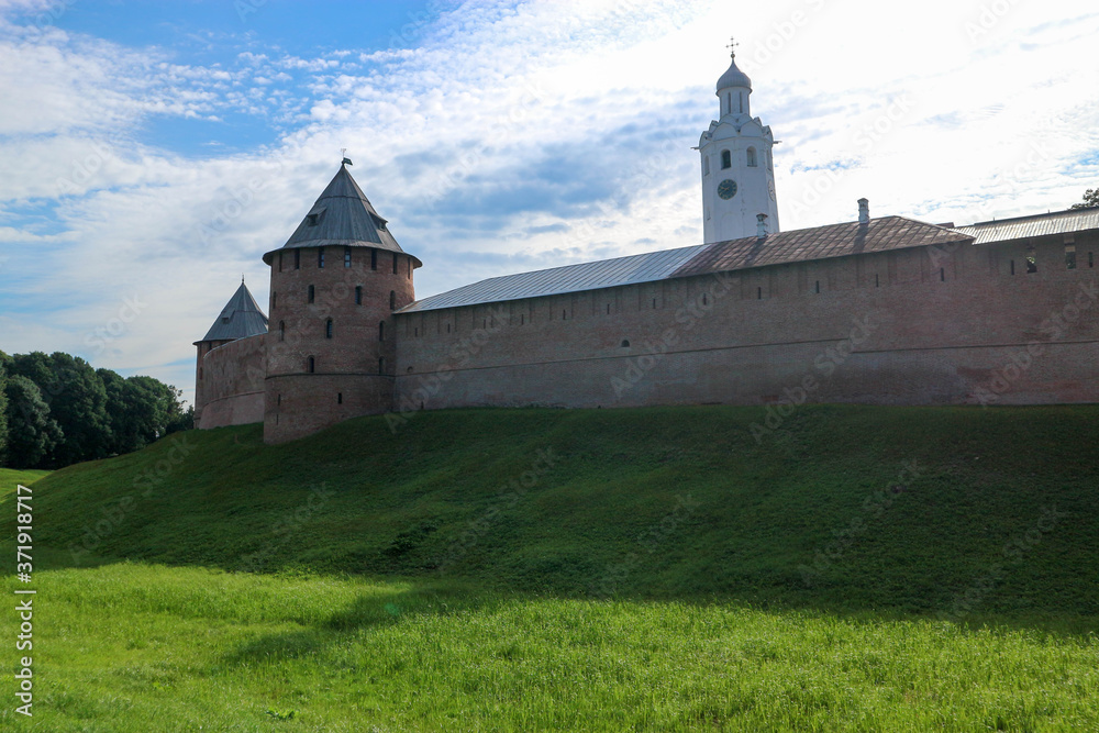 View to Metropolitan tower and wall of the Velikiy (Great) Novgorod citadel (kremlin, detinets) in Russia under blue summer sky in the morning