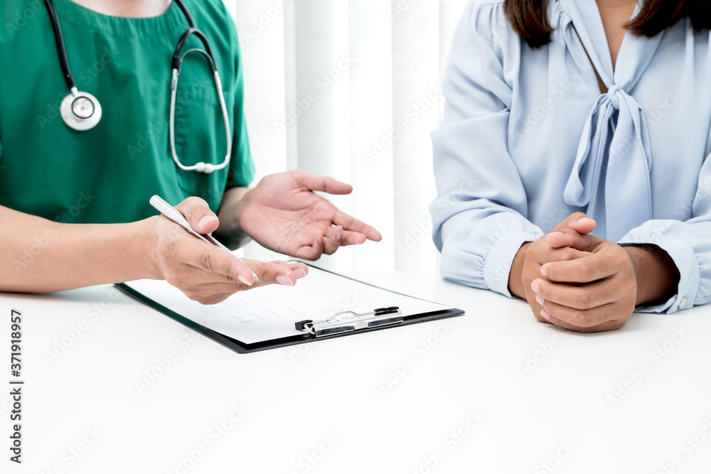 Male doctors explain and recommend treatment after a female patient meets a doctor and receives results regarding illness problems. Medical and health care concepts Male doctors explain and recommend treatment after a female patient meets a doctor and receives results regarding illness problems. Medical and health care concepts