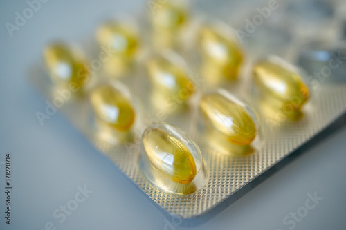 Close-up of gelatinous capsules with the cod-liver oil-omega3 in blister. Selective focus. High quality photo