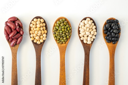 Collection of whole grains seeds isolated on white background. Healthy diet raw ingredients.