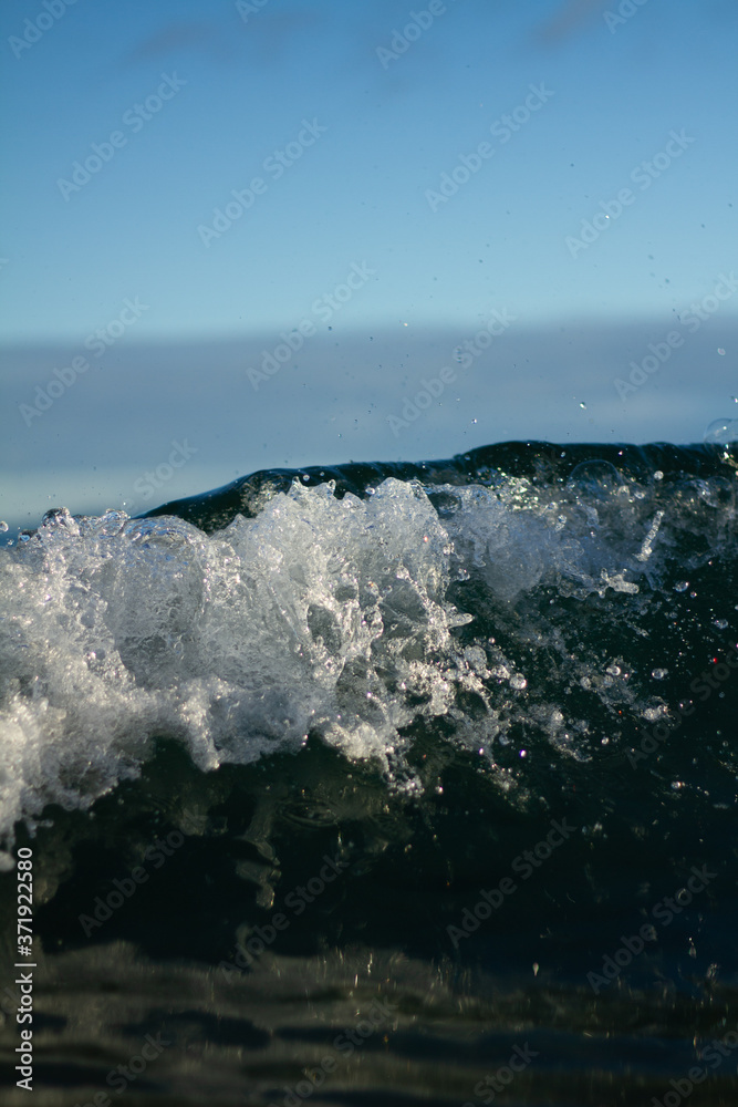 Small waves breaking on a surf beach, New Zealand. Small waves breaking on a surf beach, New Zealand.