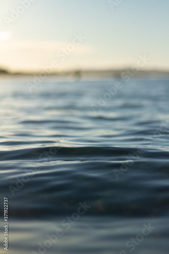 Small waves breaking on a surf beach, New Zealand. 