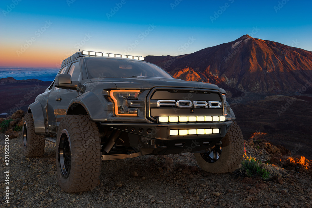 Ford F-150 Raptor - Most Extreme Production Truck On The Planet while  driving in extreme off-road Stock Photo