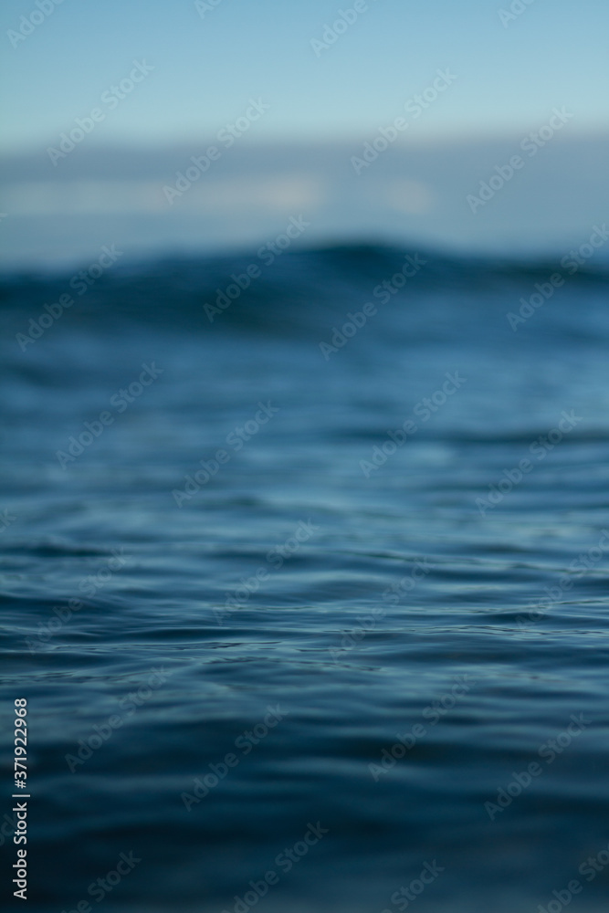Fototapeta premium Small waves breaking on a surf beach, New Zealand. 