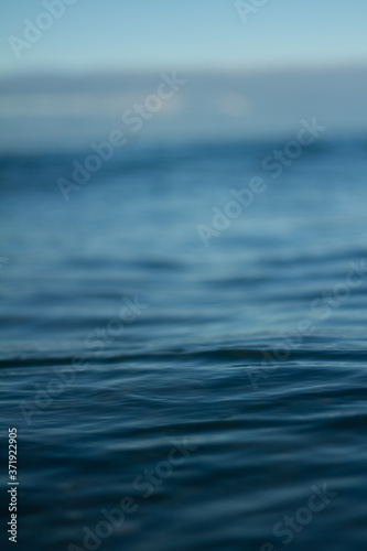 Small waves breaking on a surf beach, New Zealand. 