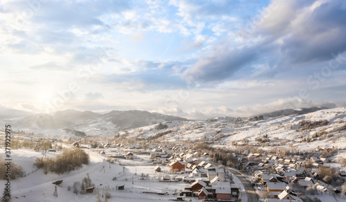 Beautiful village in a mountain winter landscape © kucherav