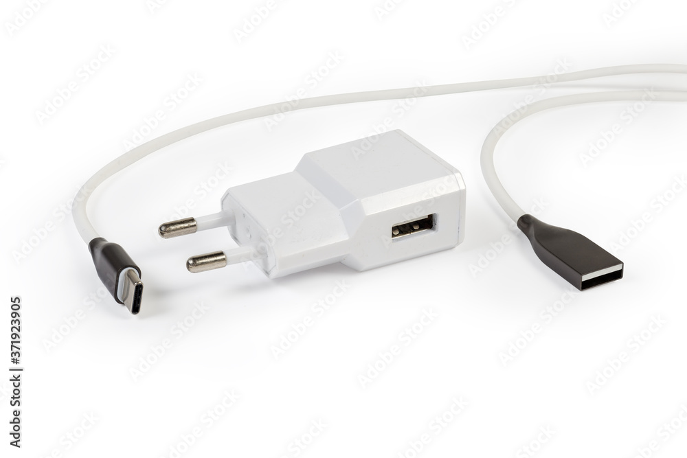 Fototapeta premium Mobile devices charger and appropriate cable on a white background