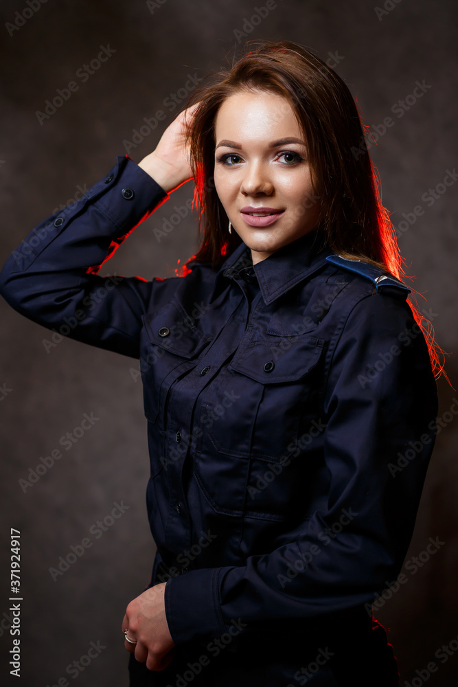 portrait of a beautiful girl in police uniform. Professional posing portrait of a beautiful girl in police uniform. Professional posing
