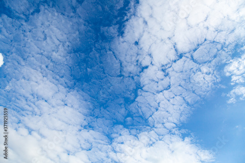 Cloudy sky. Texture. Background. Blue sky. Copy space. © zhennyzhenny