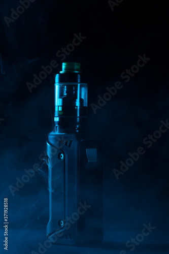 vape close-up in a smoke on a black background photo