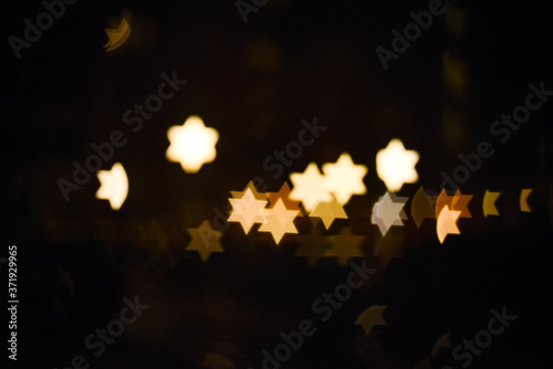 Star of David light Bokeh Effect Dark Black Background using a special camera lens filter