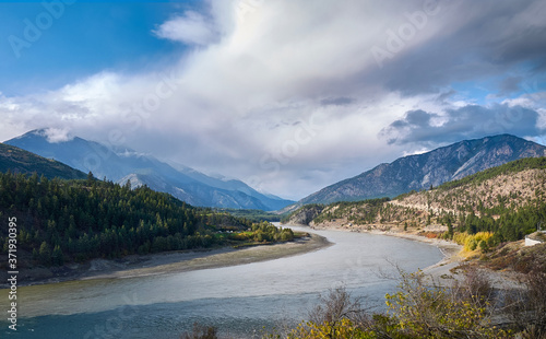 Fraser River Valley in the fall. Beautiful clouds over the mountains surrounding the valley. The confluence of the Fraser and Thomson rivers near Lytton. BC, Canada photo