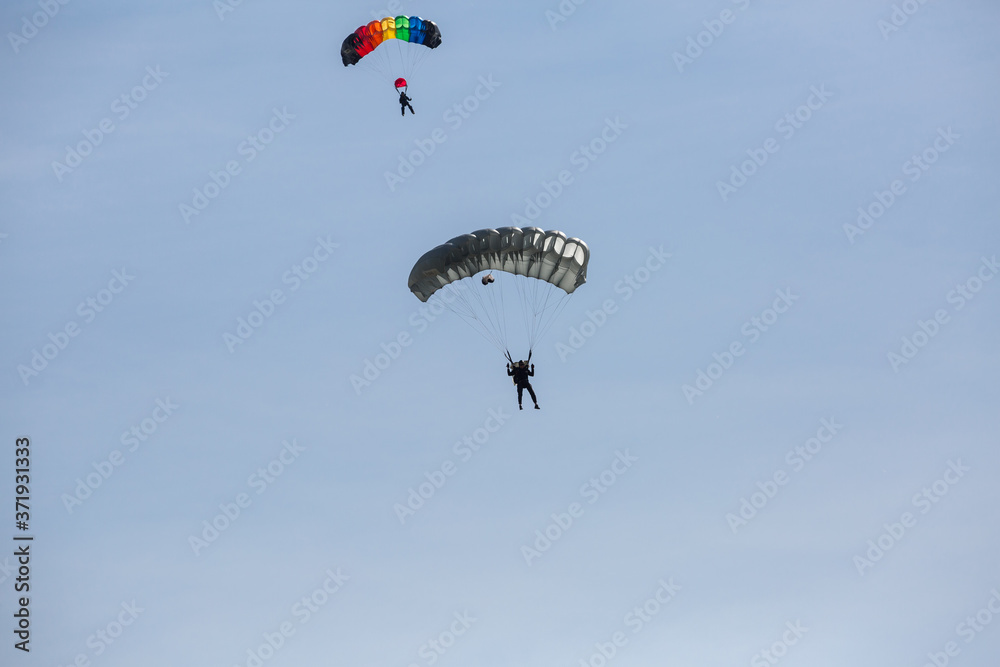 City Riga, Latvian republic. Parachutists land with parachutes on target. City Riga, Latvian republic. Parachutists land with parachutes on target.