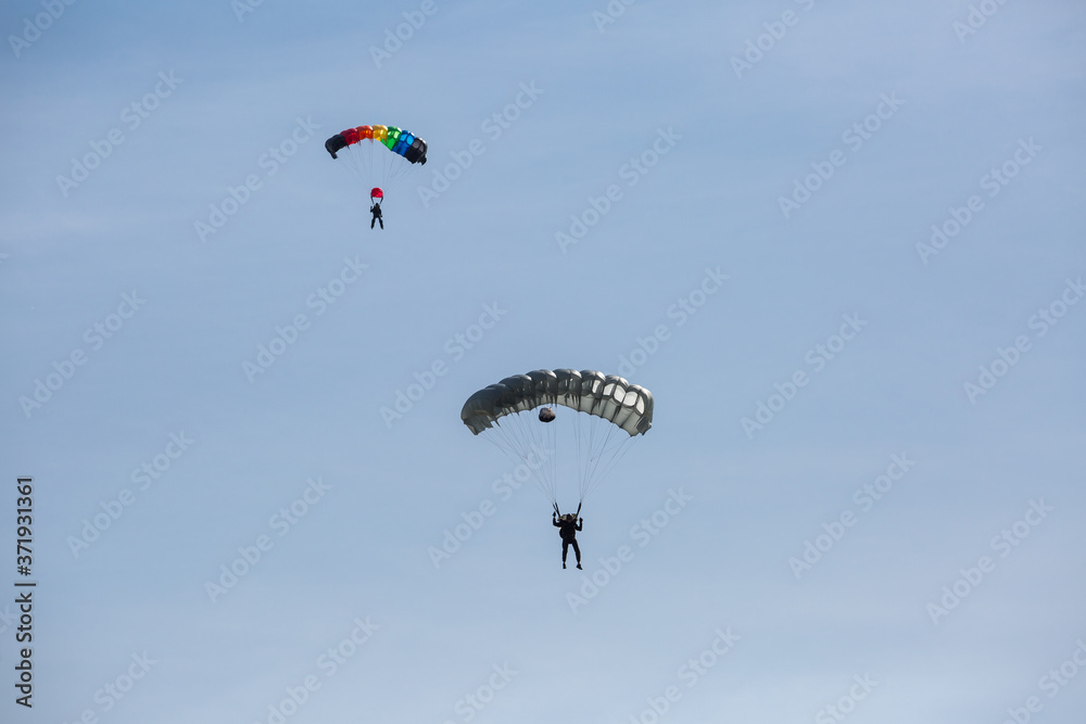 City Riga, Latvian republic. Parachutists land with parachutes on target. City Riga, Latvian republic. Parachutists land with parachutes on target.