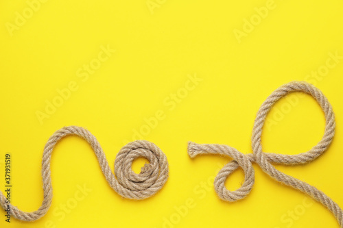 Long ropes on color background