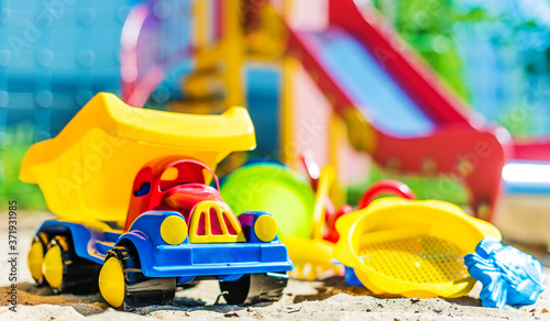 Wallpaper Mural Colorful plastic children toys on the playground Torontodigital.ca