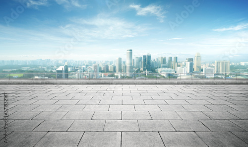 Panoramic balcony skyline and buildings view with empty brick floor.