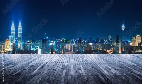 Fotografiet Rooftop balcony with night view cityscape background