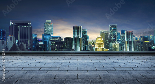 empty marble floor and cityscape night scene