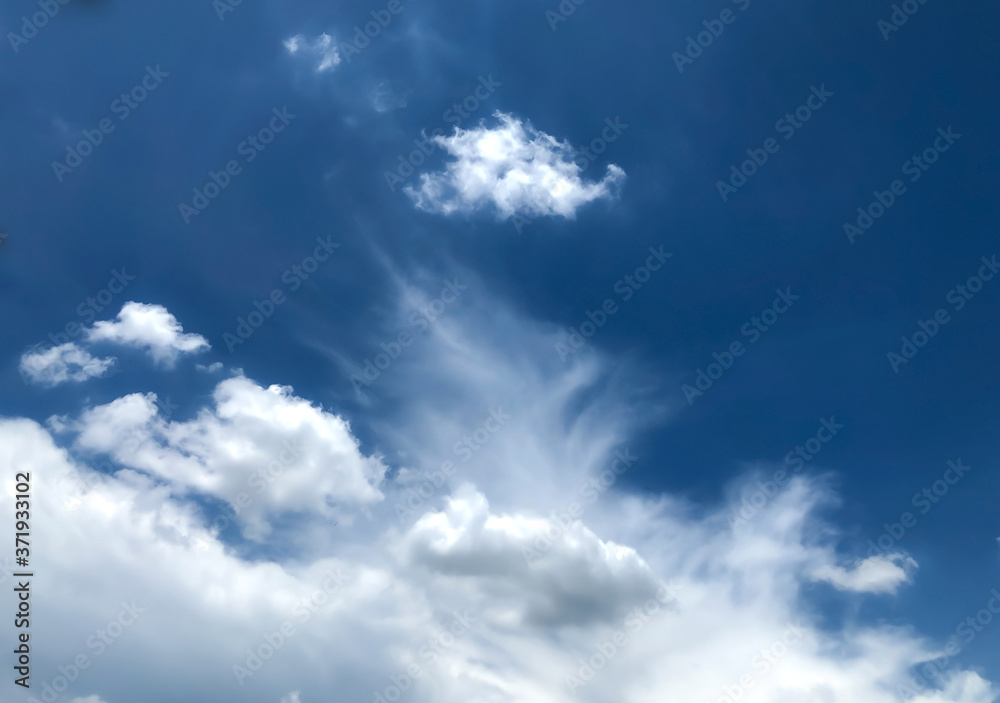 The blue sky with soft clouds for the background, view of a comfortable blue sky, relaxing and fresh, blue sky with dreamy soft clouds, the concept of creating a clear sky and clouds for Bright life.