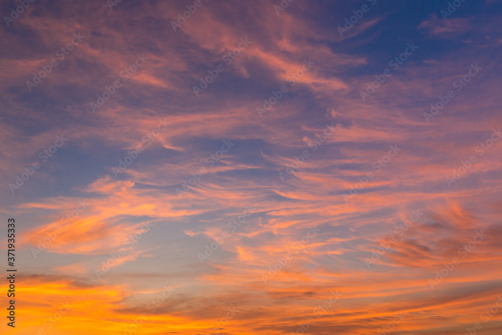 Blue and golden pink clouds sky abstract