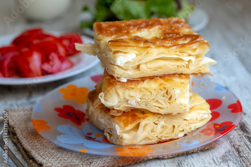 Su Boregi / Turkish Patty on wooden surface.