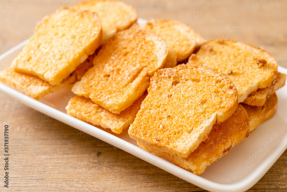 baked crispy bread with butter and sugar baked crispy bread with butter and sugar