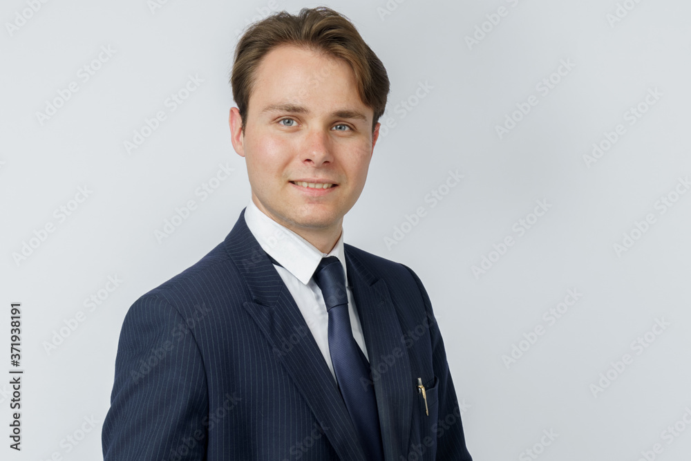Businessman in a blue suit on a white background. Businessman in a blue suit on a white background.