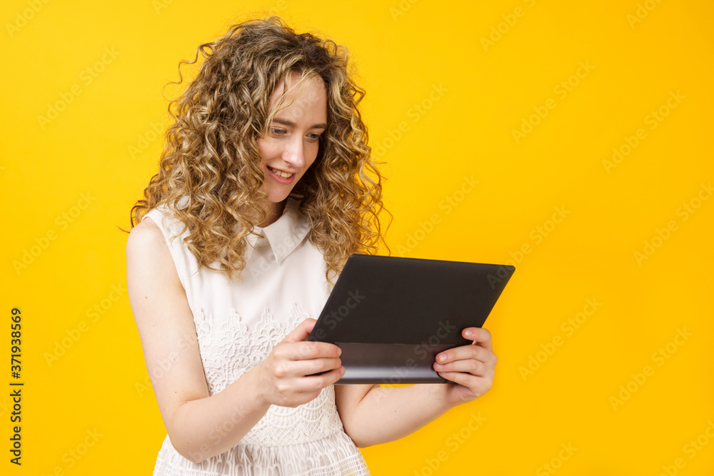 Portrait of a young woman who communicates on a tablet. Female portrait. Portrait of a young woman who communicates on a tablet. Female portrait.