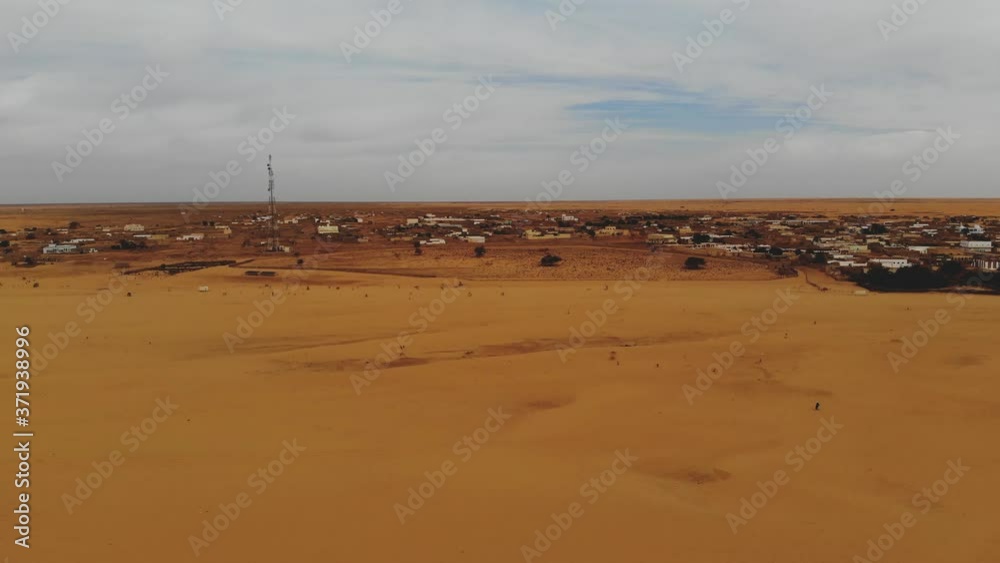 Panoramic view of a settlement in Mauritania. settlement in Mauritania. Settlement. View. 4k. 4k view.Village. Town. A life. Bird's eye view. Mauritania in 4k. panorama in 4k. Mauritania. Panoramic view of a settlement in Mauritania. settlement in Mauritania. Settlement. View. 4k. 4k view.Village. Town. A life. Bird's eye view. Mauritania in 4k. panorama in 4k. Mauritania.