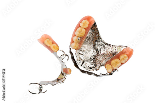 Top view of removable dentures lower and upper on white background.