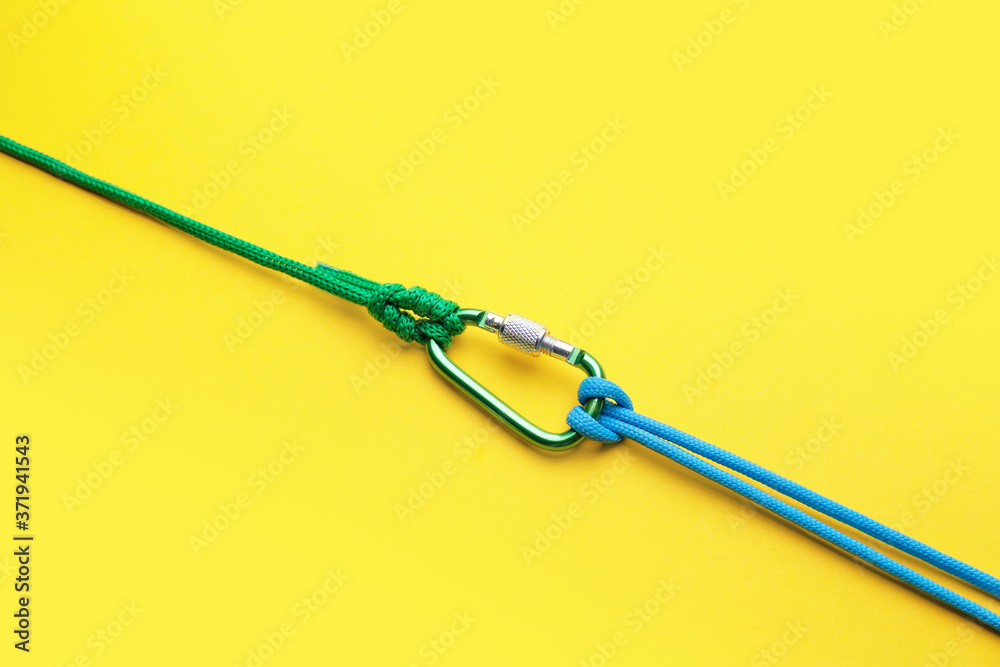 Ropes with lobster clasp on color background Ropes with lobster clasp on color background