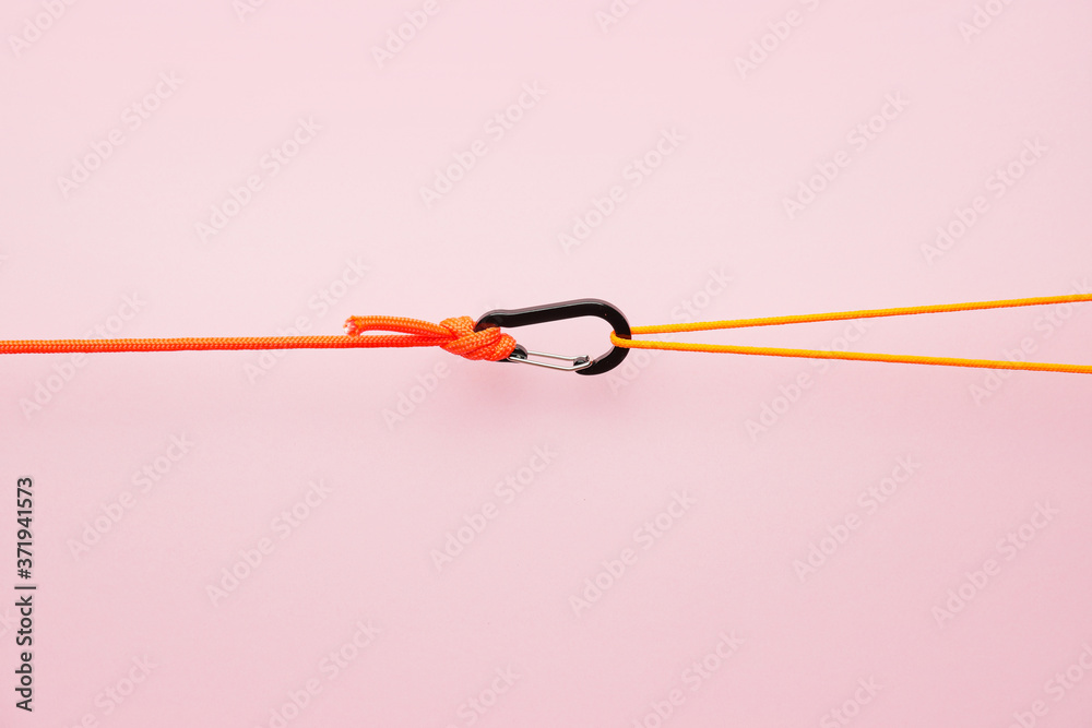 Ropes with lobster clasp on color background Ropes with lobster clasp on color background