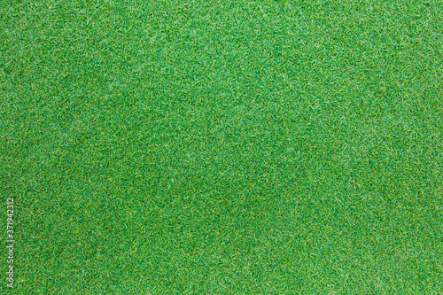 Green artificial grass suitable for a background image.