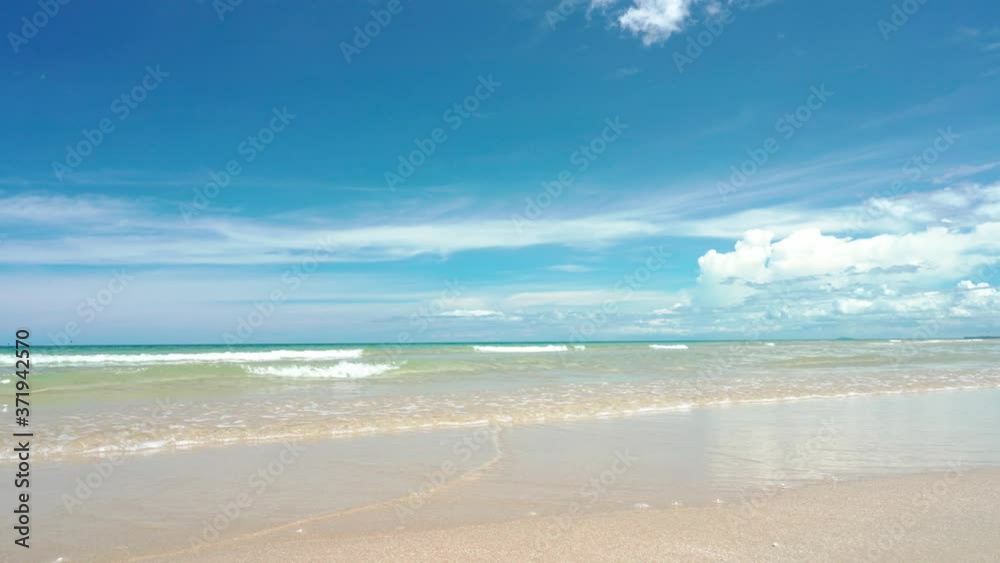 Sea wave on the beach with beautiful turquoise blue sea view in summer Sea wave on the beach with beautiful turquoise blue sea view in summer