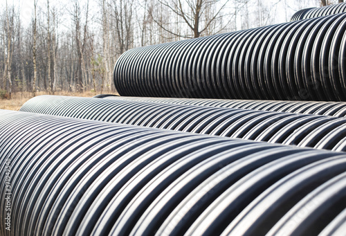 Large diameter plastic pipes for supplying heating and water supply to the house. Modern method of laying durable pipes  chemical resistance  copy space. Industry