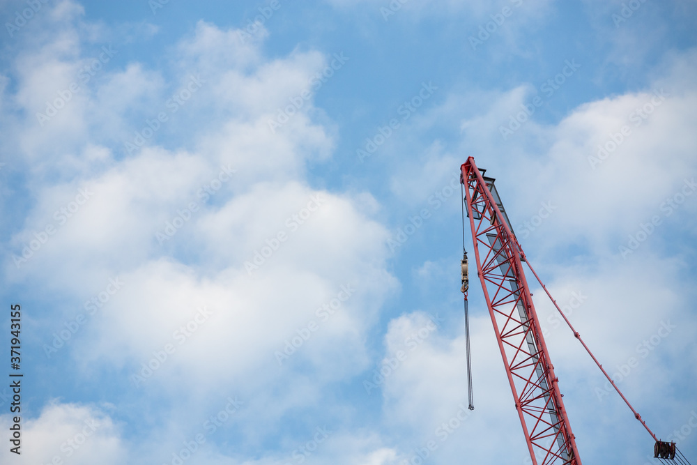 red crane on blue sky red crane on blue sky