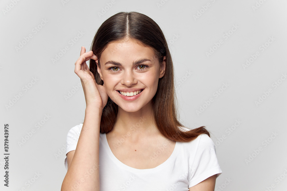 Happy brunette smiling over an isolated background Happy brunette smiling over an isolated background
