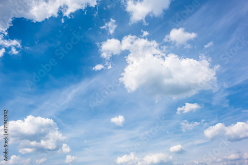 Blue summer sky with clouds as a background