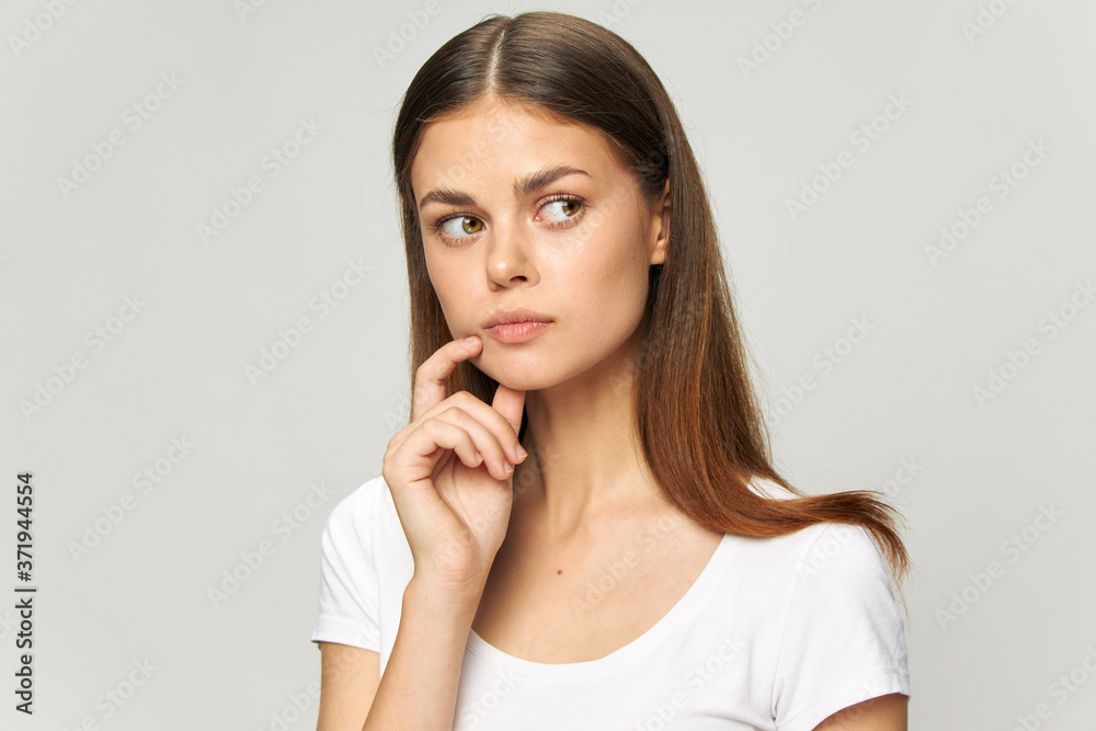 Woman looking to the side puzzled look face sleeves Woman looking to the side puzzled look face sleeves